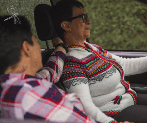 two people sitting in a car